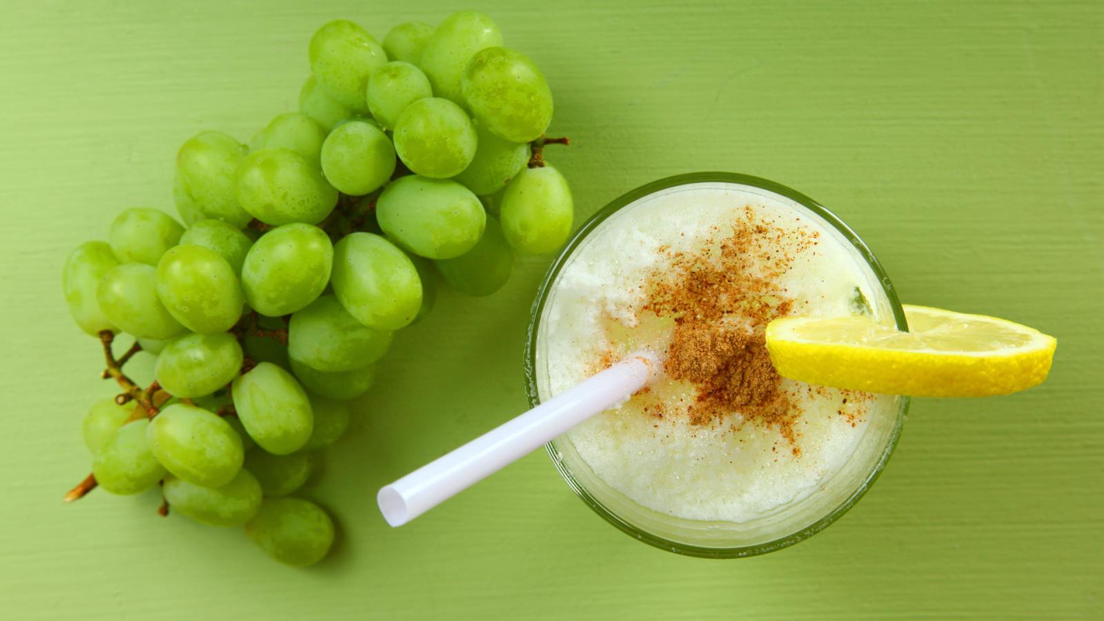 Pisco Sour drink and grapes.