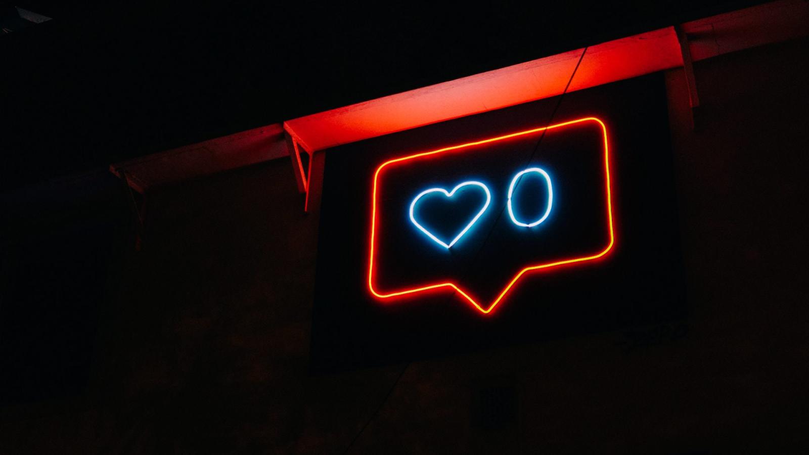 Neon sign representing Instagram likes notification showing zero likes.